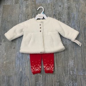 White faux fur jacket and red pants